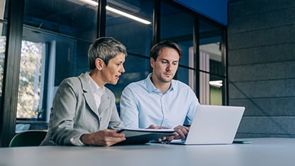 Colleagues discussing a project at work