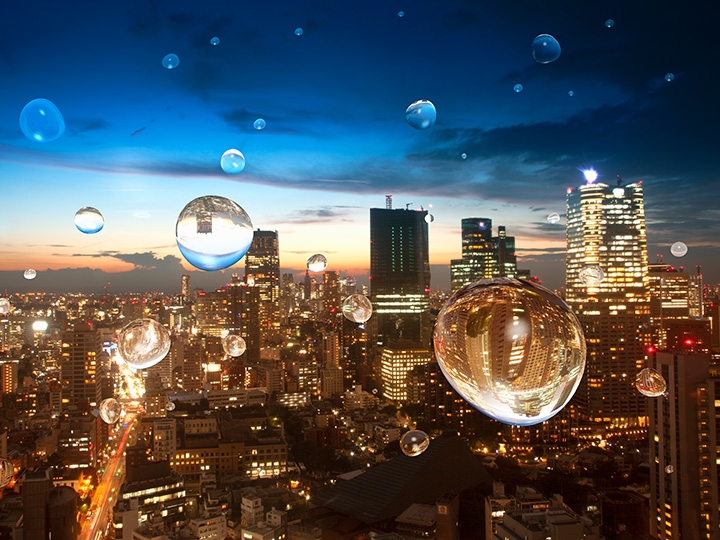 Water drops in front of a city skyline at night